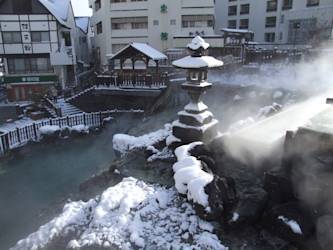 Kusatsu Onsen Yubatake in Winter – Snowy Landscape and Rising Steam
