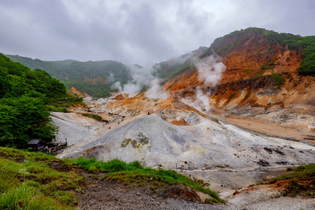 Noboribetsu Onsen Steam rising from the dramatic volcanic landscape of Hell Valley