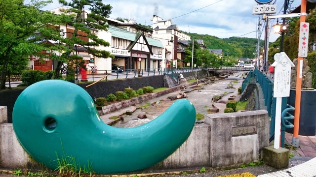 Discover the symbolic magatama at Tamatsukuri Onsen Izumo, where ancient legends and healing waters converge along the serene Tamayu River.