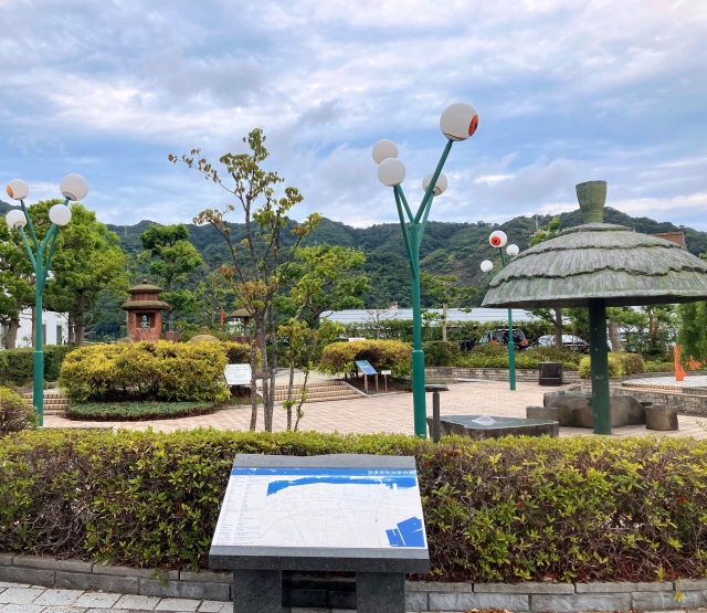 Tamatsukuri Onsen Izumo Mizuki Shigeru Road with iconic lanterns and lush greenery.