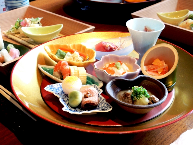 A colorful assortment of traditional Kyoto kaiseki dishes served in Arashiyama Kyoto, showcasing seasonal ingredients and refined presentation.