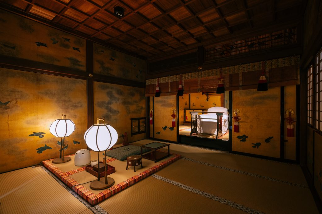 The Yushinden imperial bathing room at Dogo Onsen Honkan, featuring elegant tatami floors, gold-leaf screens, and traditional furnishings.